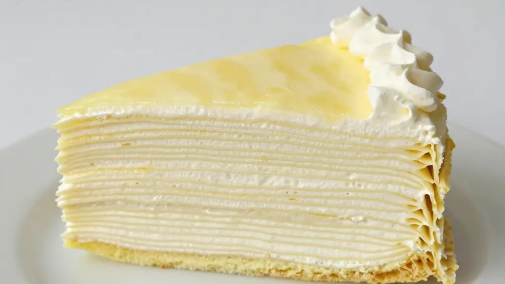 Can You Bake in a Glass Pan Without Messy Surprises 3 Closeup slice of layered cake in glass pan