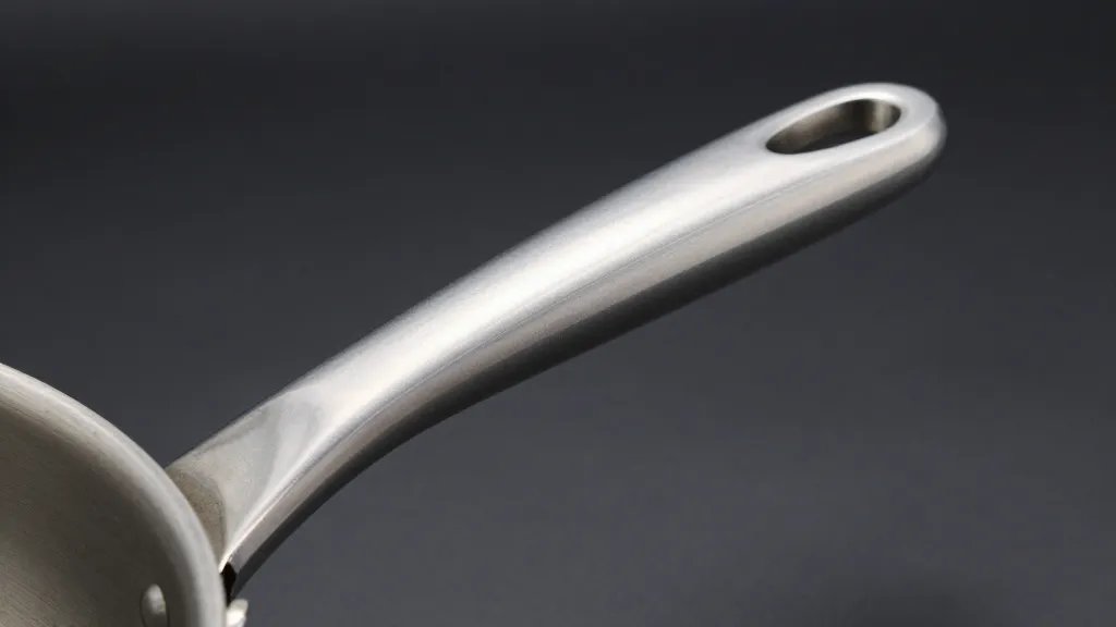 Microwave Safety Guide: Using Aluminum Pans Without Disaster 4 closeup of aluminum pan handle with subtle spark glow