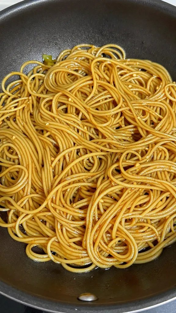 One-Pan Vegan Garlic Noodles: Quickweeknight Wows 3 Closeup of a single skillet with glossy garlic noodles