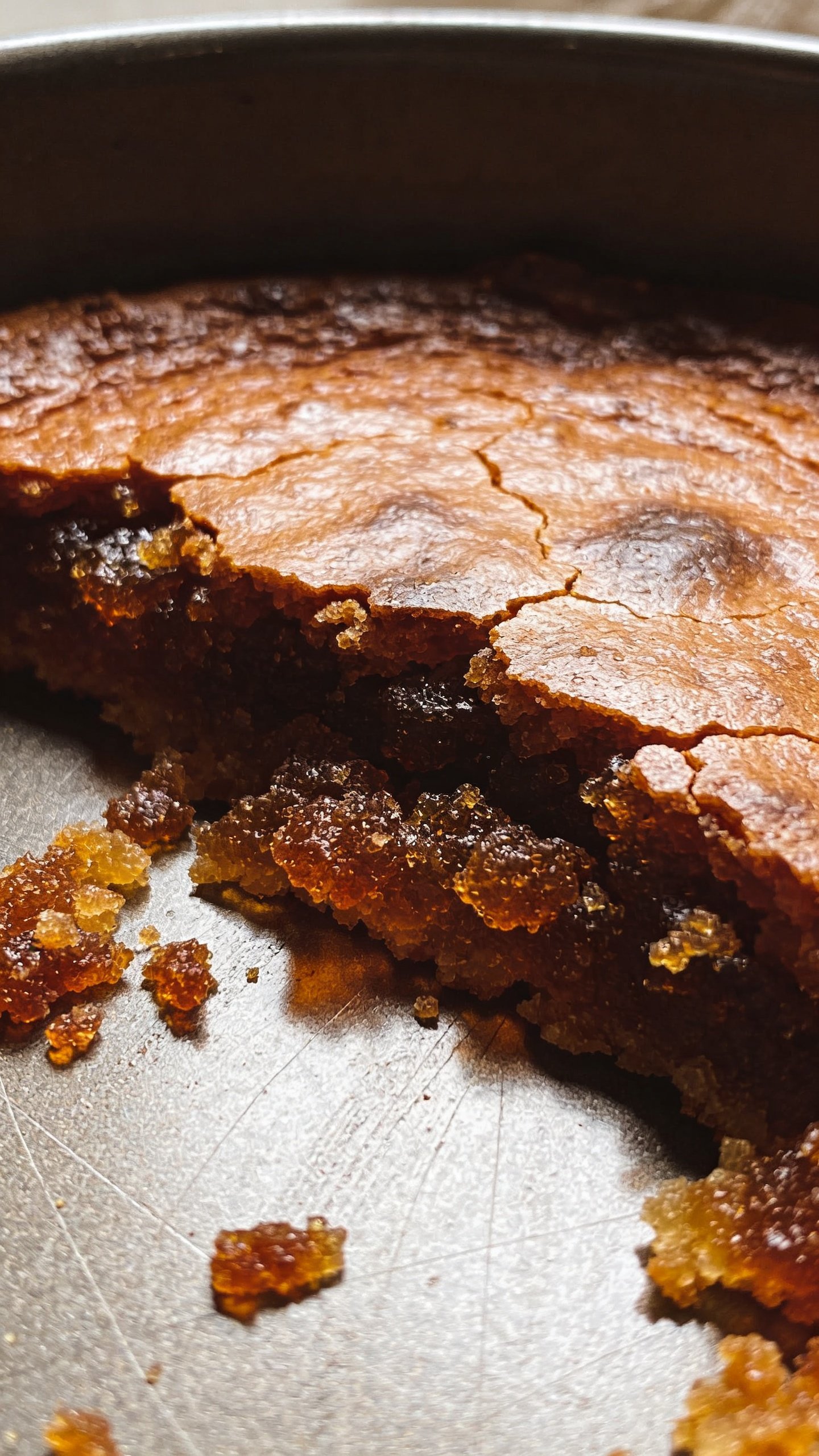 How to Get Burnt Sugar Off a Pan in 5 Quick Steps 2 Closeup of burnt sugar crust on metal pan surface
