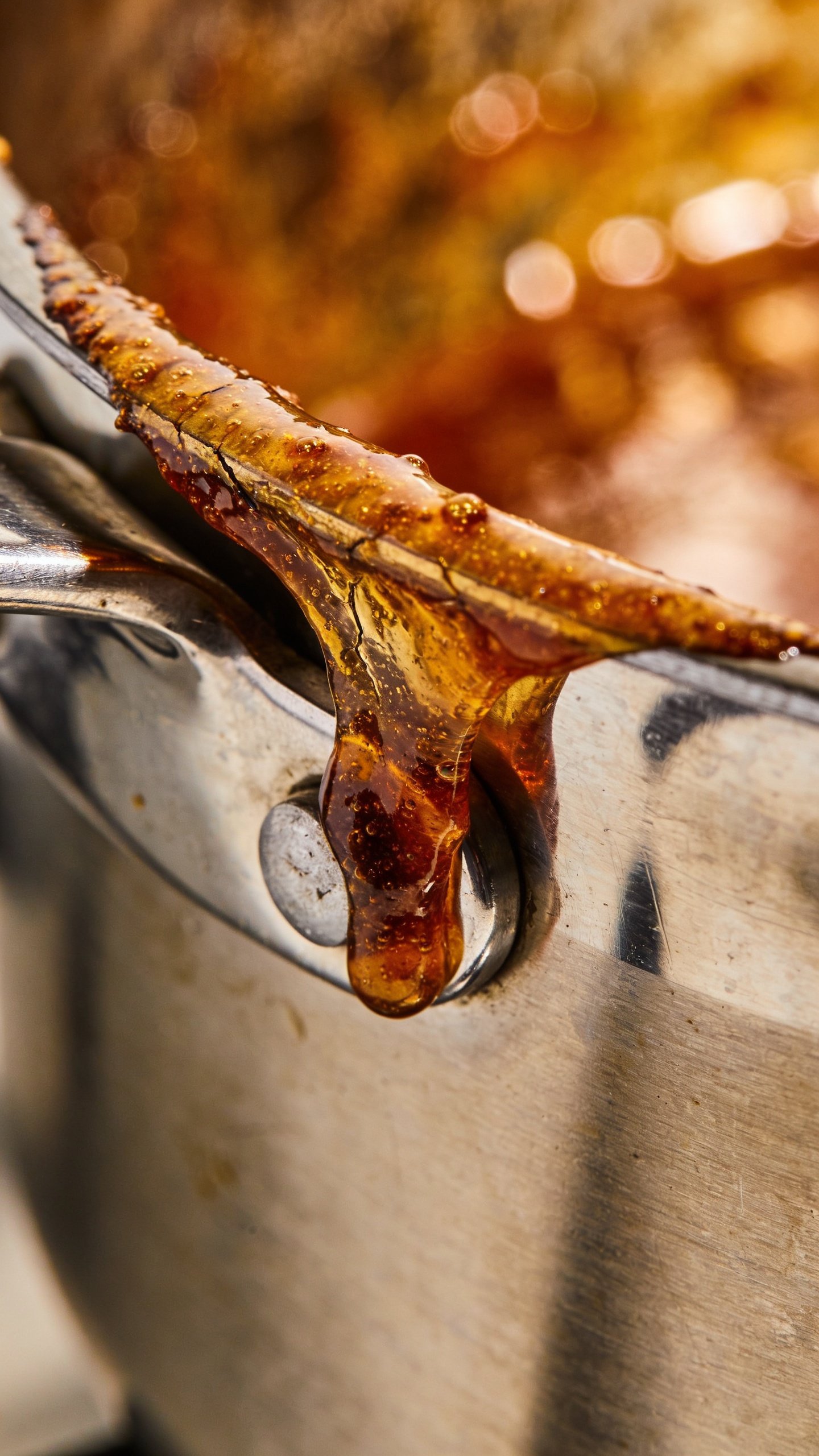 How to Get Burnt Sugar Off a Pan in 5 Quick Steps 4 Tight focus on gloss of burnt sugar layer clinging to stainless pan edge
